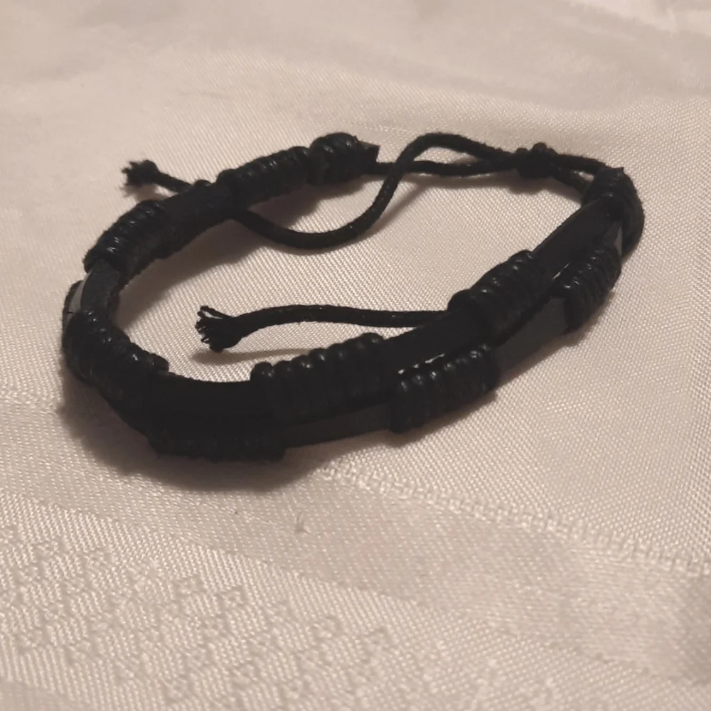3 black bracelets